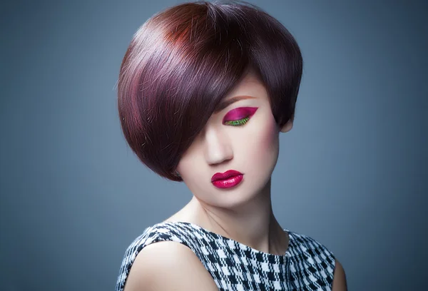 Beautiful woman portrait with fashion haircut and creative trendy make-up
