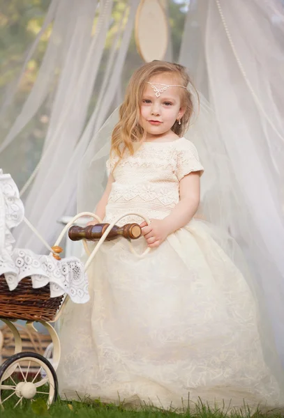 Outdoor portrait of cute little girl in princess dress