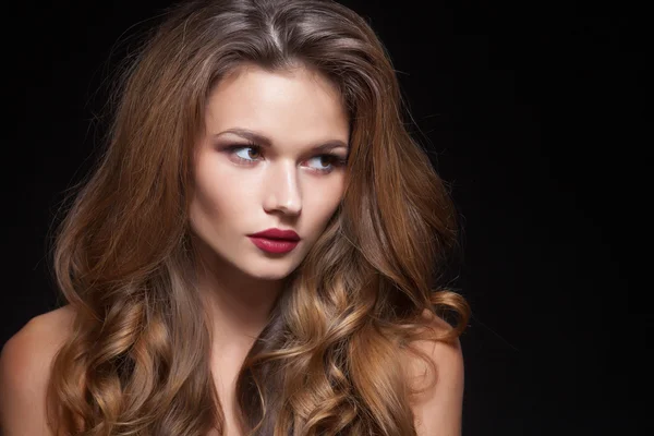 Beautiful natural curly blonde hair, portrait of an young girl