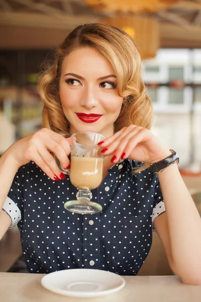 Retro beautiful woman in restaurant cafe with coffee