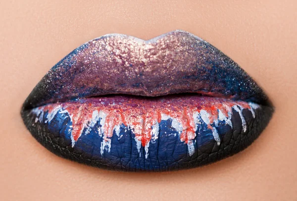 Creative and fashion make up on woman lips. macro photo. studio shot