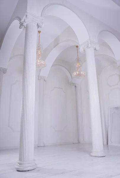 Beautiful white hall baroque with columns and with high ceilings