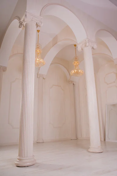 Beautiful white hall baroque with columns and with high ceilings