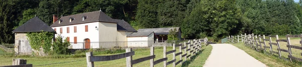 Farm houses and road with fence