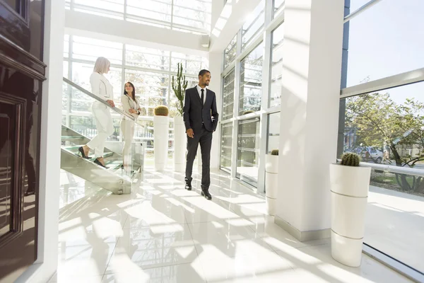 Young people walking in the office