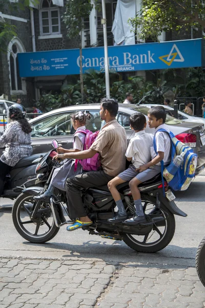 Unidentified Indian family rides a motorbike