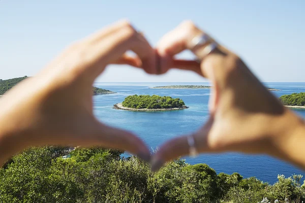 Heart shape made from human fingers