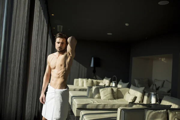 Man with a towel in a room