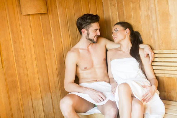 Young couple relaxing in the sauna