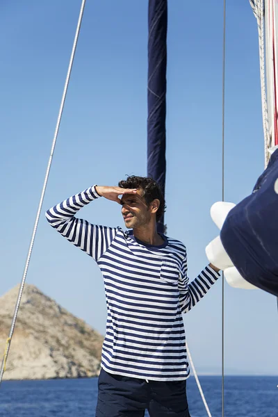 Young man on sailboat