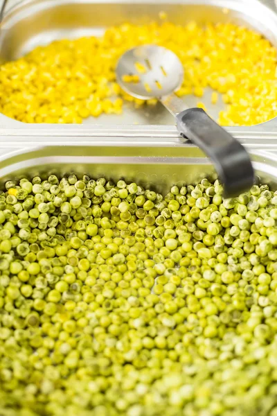 Peas and corn with spoon