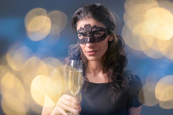 Party woman holding glass with champagne