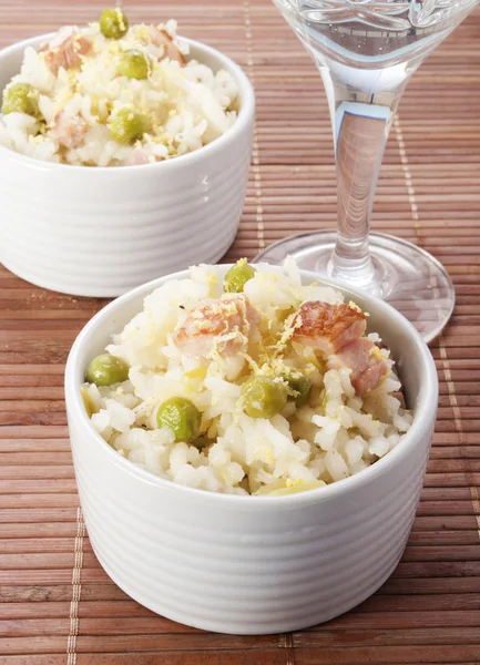 Lemon rice with bacon and peas in a cup