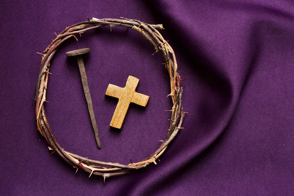 Christian cross, nail and the crown of thorns of Jesus Christ
