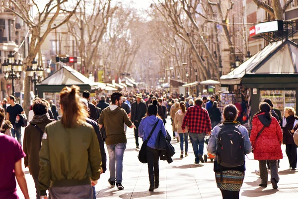 People walking in La Rambla, in Barcelona, Spain