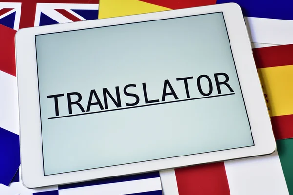 Different flags and the word translator in the screen of a table