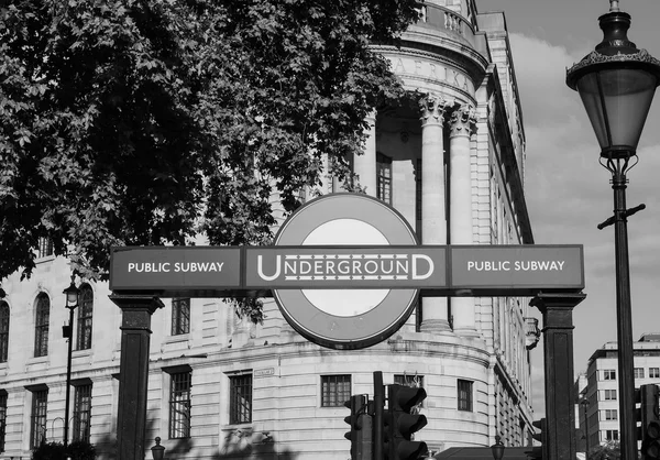 Tourists visiting London in black and white