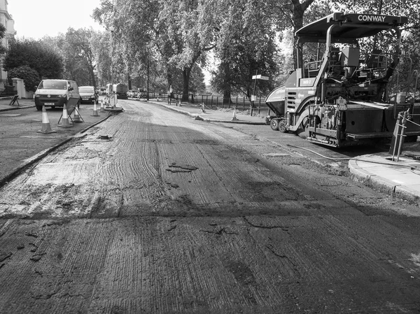 Road paving in London in black and white