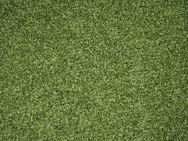 Green artificial synthetic grass meadow background