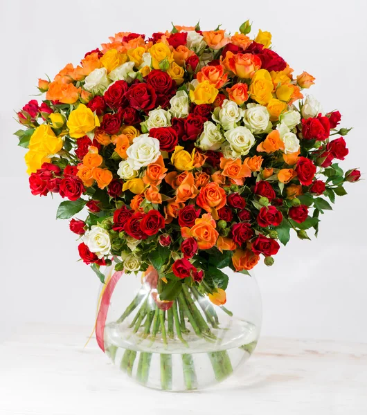 Colorful shrub rose bouquet in a vase