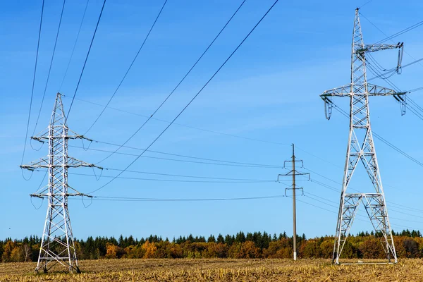 High-voltage wires on a background of blue sky