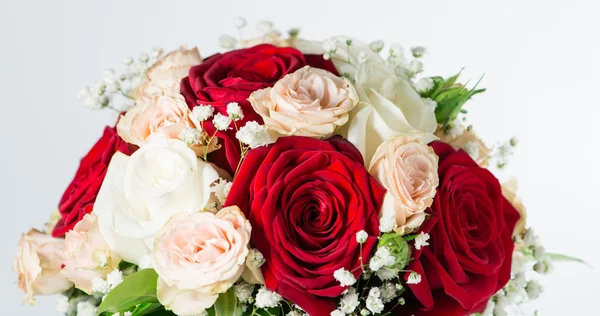 Red bridal bouquet isolated on white background (shallow DOF)