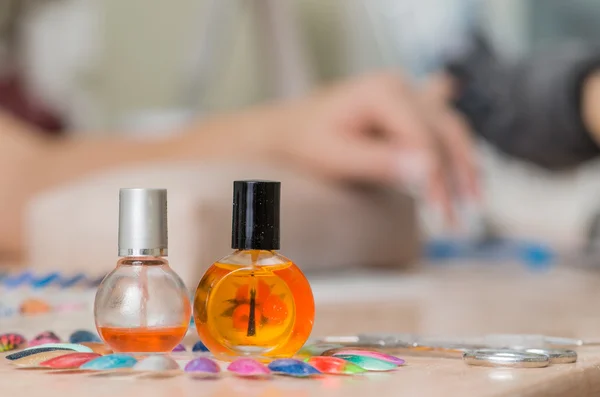 Bottles and tools for manicure after work close-up in nail salon