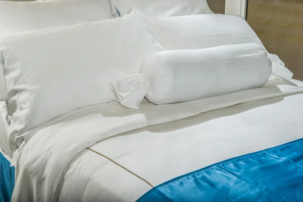 Comfortable soft pillows situated on the bed.