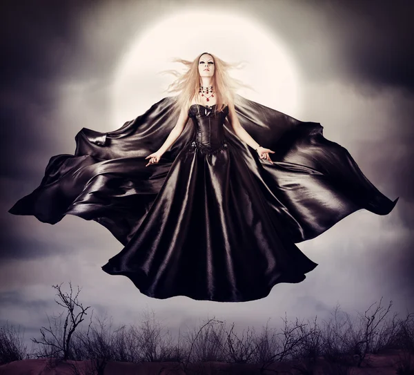 Beautiful woman - flying halloween witch