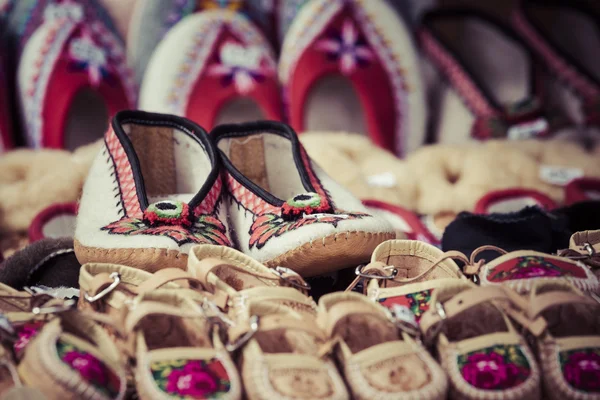 Handmade shoes made of leather decorated with the traditional wa