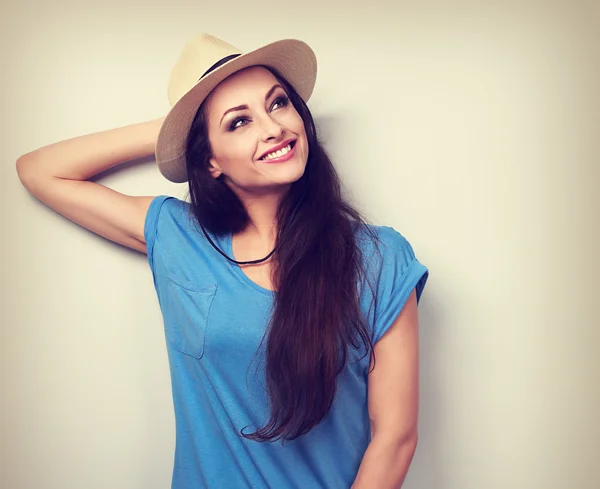 Relaxing happy smiling woman in hat thinking about summer holida