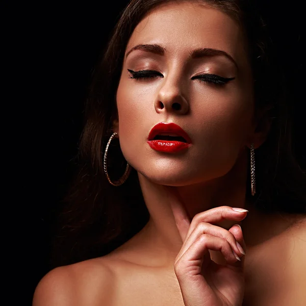 Beautiful makeup female model with red lips and black eyeliner