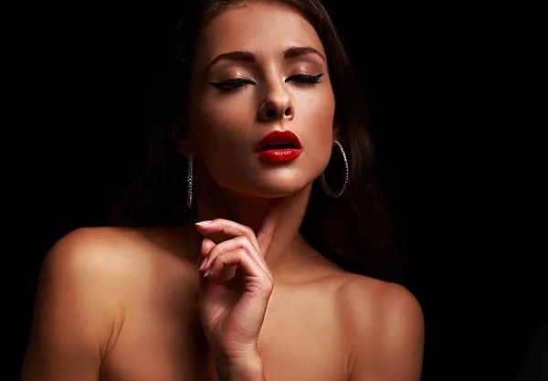 Beautiful sexy woman with close eyes with bright red lipstick