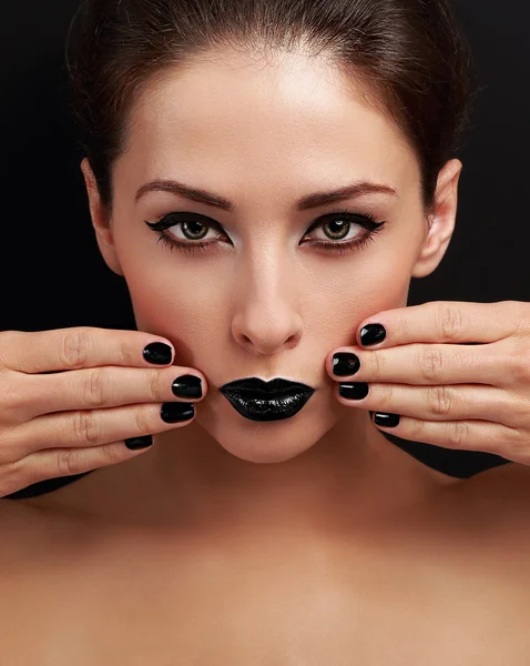Beautiful bright evening makeup woman, black nails polish and black lipstick