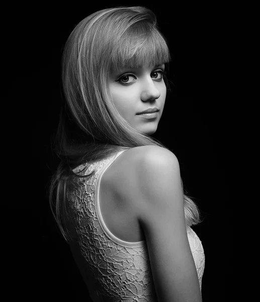 Beautiful makeup young woman with blond hair. Black and white portrait