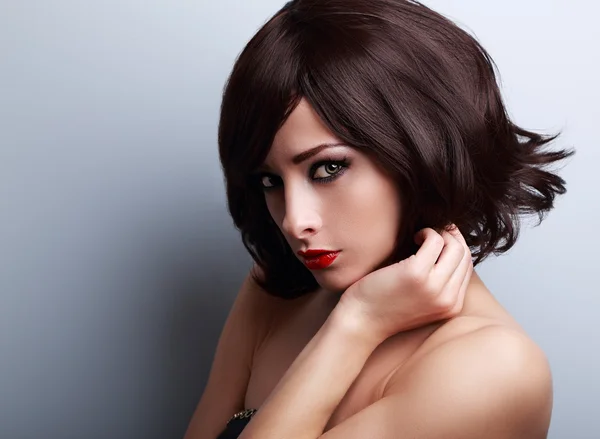 Sexy bright makeup woman with short black hair style