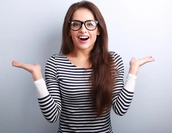 Beautiful excited woman in glasses with natural surprising emoti