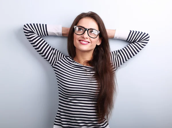 Beautiful relaxing woman in glasses looking up with thinking loo