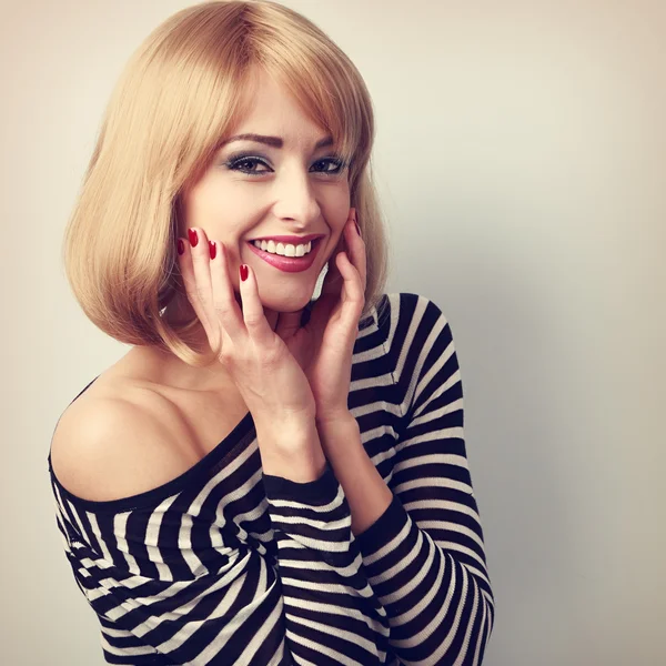 Laughing beautiful blond woman with short hairstyle in fashion b