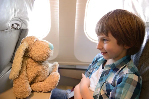 Little boy inside airplane