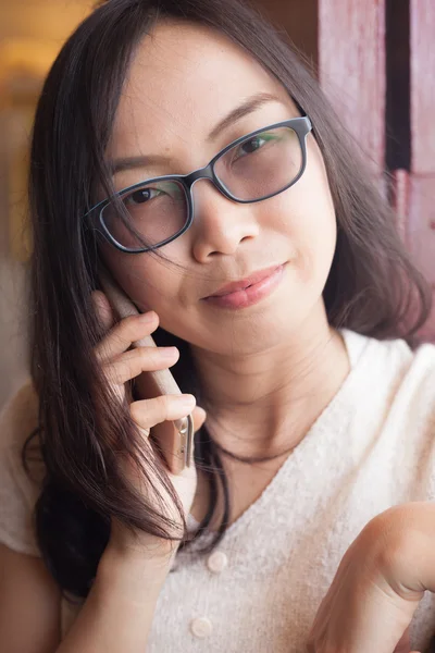 Asia woman talk phone.