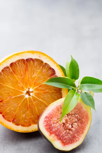 Bloody Sicilian oranges and figs. Shallow depth of field.