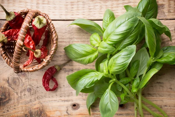Basil. Bunch fresh basil on a wooden background. Aromatic spice.