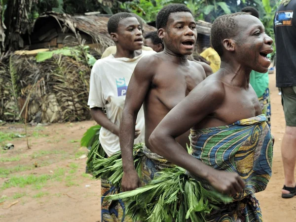 People from a tribe of Baka pygmies in village of ethnic singing. Traditional dance and music. Nov, 2, 2008 CAR