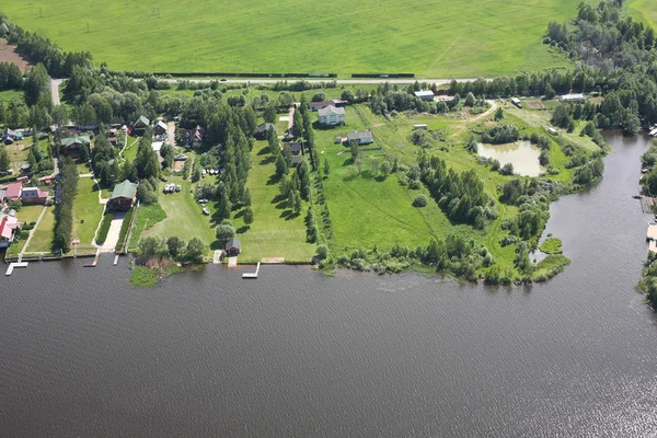Aerial Views - Houses on the river bank