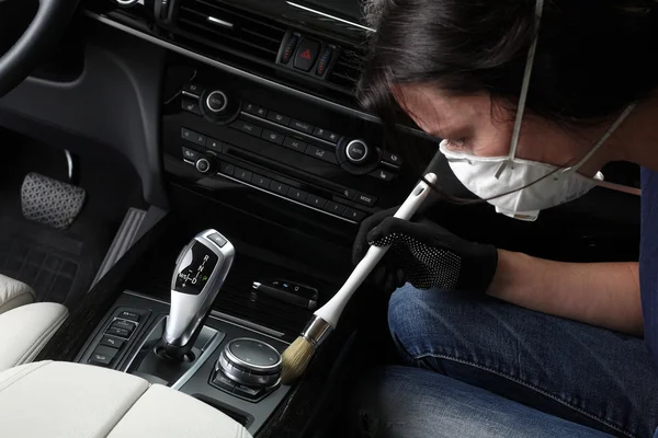 Car service. Cleaning of  interior by a brush
