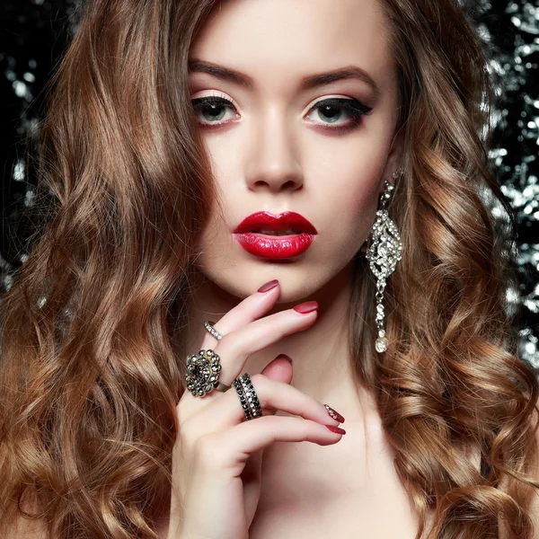 Fashion girl portrait  on a silvery background.Accessorys. Long curly hairs