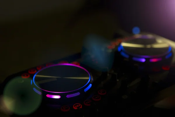 DJ console music party in nightclub