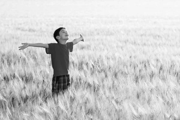 Black and white portrait of kid enjoying the sun
