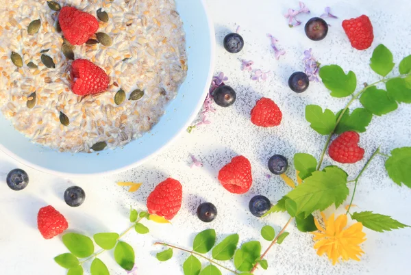 Fresh, morning cereal meal with floral arrangement and fresh fruit